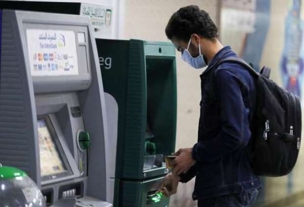 غرامة على من لا يرتدى الكمامة أثناء السحب من ماكينة الصراف الآلي ATM