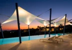 مظلات شد إنشائي - مشروع تنفيذ Bomba Now لتظليل Pool Deck كومباوند فاخر في مصر